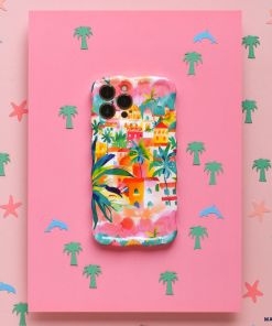 The Wavy Phone Case - Portofino Dreams by Coconut Lane is an extra protective phone case adorned with a vibrant tropical village design, featuring palm trees and houses. Set against a pink background dotted with small pastel palm tree, dolphin, and starfish icons, this case captures the coastal charm inspired by an Italian seaside getaway.