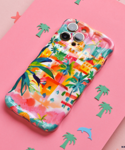 The Wavy Phone Case - Portofino Dreams by Coconut Lane, featuring a vibrant and colorful design adorned with tropical-themed drawings of palm trees, buildings, and abstract patterns, sits on a pink surface. This extra protective Italian seaside design is set against a background sprinkled with small cutouts of green palm trees and a blue dolphin.