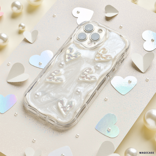 Introducing the Pearly Hearts Phone Case - Clear from Coconut Lane for the iPhone 15. This extra protective case showcases raised, shiny heart designs against a pearlescent, swirled background. It elegantly complements any look while your phone rests on a beige, glittery surface adorned with metallic heart confetti and pearl-like beads. Combining style and safety seamlessly, it's the perfect blend of functionality and glamour.