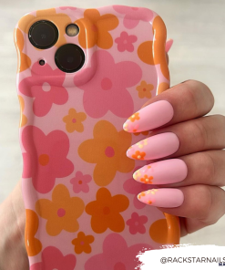 A hand with pastel pink nails featuring orange floral designs holds a Coconut Lane Wavy Phone Case - Pink & Orange Bloom. The user's handle @RACKSTARNails is displayed in the bottom right corner.