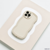 Flatlay style image of cream phone case with wavy edges.
