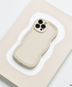 Flatlay style image of cream phone case with wavy edges.