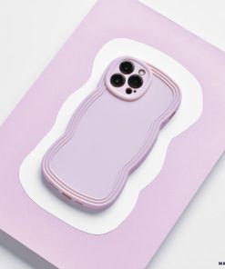A NAKD Curvy smartphone with a Coconut Lane NAKD Curvy Phone Case - Blueberry, featuring a wavy, textured design, is placed on a light purple and white background. The lightweight case covers the phone completely, with cutouts for the camera and other necessary ports.