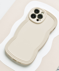 Flatlay style image of cream phone case with wavy edges.