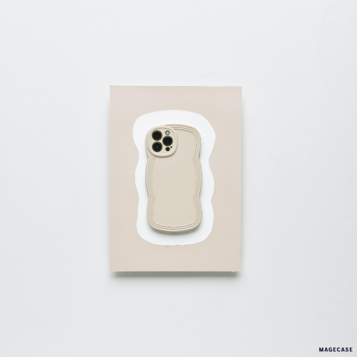 A minimalist, lightweight NAKD Curvy Phone Case - Vanilla by Coconut Lane in a neutral beige color is placed on a matching beige rectangular card against a white background. The case has cutouts for the camera and buttons, and its edges are subtly contoured for highly protective functionality.