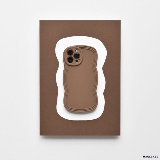 Displayed on a card featuring an abstract white wavy shape on a brown background, the NAKD Curvy Phone Case - Coffee by Coconut Lane is a lightweight and highly protective case with wavy edges. This minimalist design uses neutral tones, making it perfect for those who value both style and functionality in their Curvy Phone Cases.