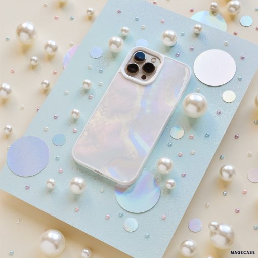 A Mother of Pearl Phone Case from Coconut Lane lies on a light blue, glittery surface surrounded by various sizes of white pearls and holographic circles. The pearlescent effect creates an aesthetic and dreamy visual effect.