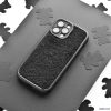 A black Cosy Teddy Phone Case from Coconut Lane is displayed on a grey surface. The protective phone case has cut-outs for the camera and buttons. The background features scattered black cloud-shaped cut-outs on white paper, creating a contrasting pattern.