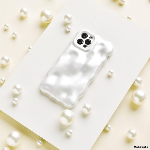 The 3D Pearl Phone Case - White from Coconut Lane, featuring a wavy texture and a glossy pearl white finish, is placed on a flat white surface surrounded by scattered pearls of various sizes. The case has precise openings for the camera and sensors at the top.