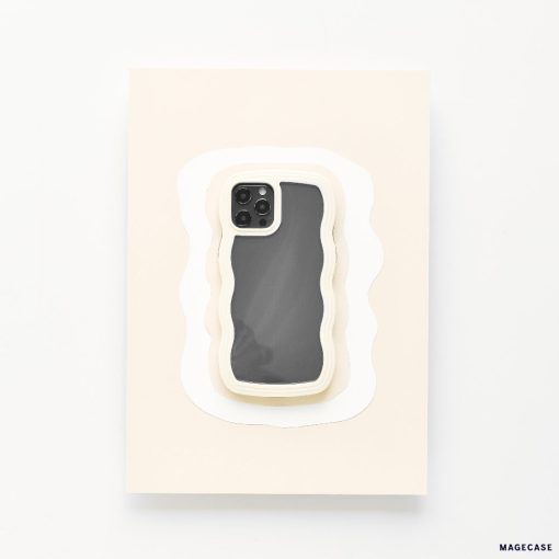 A highly protective Coconut Lane Curvy Phone Case - Cream, featuring a wavy design, is placed centrally on a rectangular surface layered to resemble paper cut-outs in various shades of white. The screen of the iPhone 15 is off, reflecting light slightly.