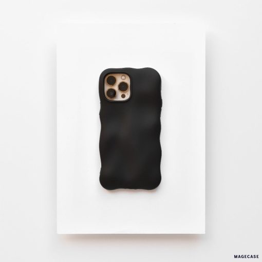 A Coconut Lane smartphone enclosed in a 3D Boujee Phone Case - Matte Black is placed on a white surface. The phone's rear camera, featuring three lenses and a flash, is visible through a cutout in the extra protective case. The overall layout exudes a minimalist and modern aesthetic.