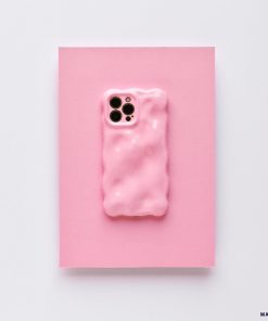 A 3D Gummy Phone Case - Pink by Coconut Lane is displayed on a pink background. This chic phone case, with its wavy, bubble-like design and glossy finish, features cutouts for the camera lenses. It offers extra protective coverage while maintaining a minimalist aesthetic with a cohesive pink theme.